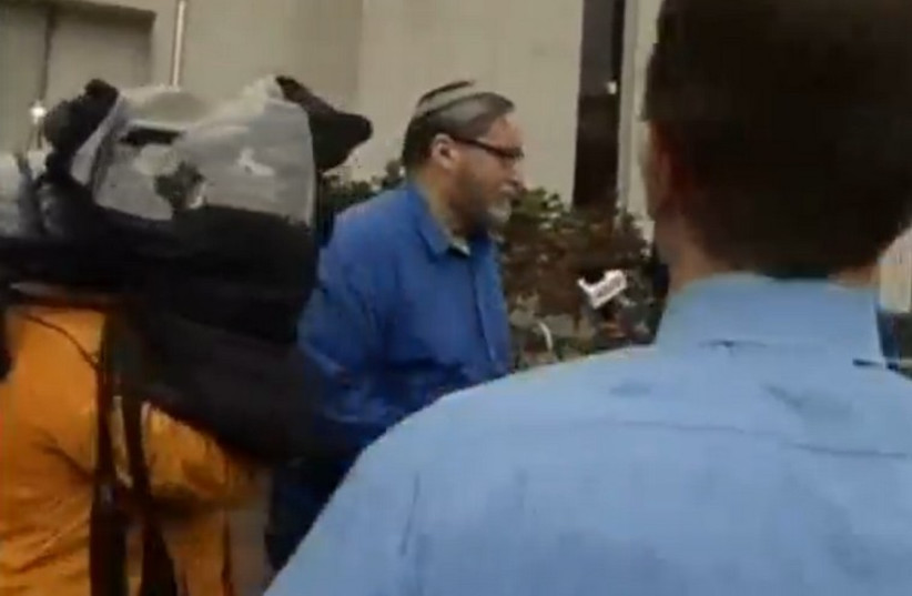 Rabbi Barry Freundel leave courthouse, February 19, 2015 (photo credit: screenshot)