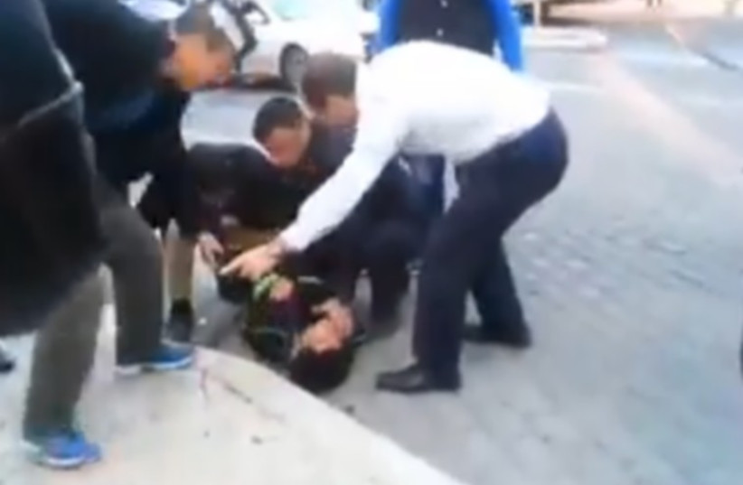 Jerusalem Mayor Nir Barkat and his security guards apprehend a Palestinian terrorist (photo credit: Courtesy)