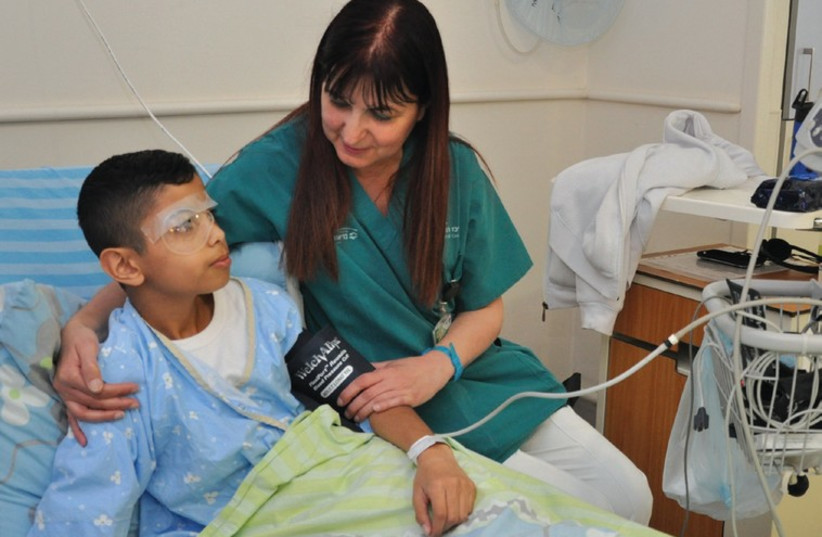 REHOVOT BOY Gad Shahar, 12, recovers in the city’s Kaplan Medical Center yesterday after being accidentally shot in the eye by a friend’s air rifle. (photo credit: Courtesy)