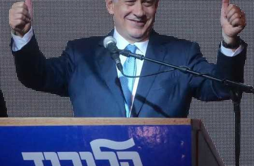 Prime Minister Benjamin Netanyahu gestures during his victory speech at Likud headquarters (photo credit: MARC ISRAEL SELLEM)