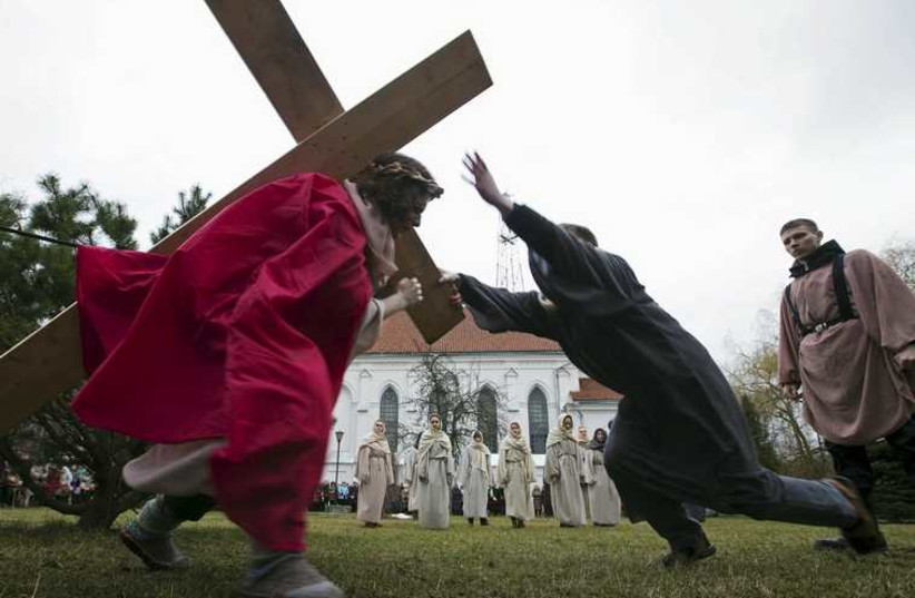 Belarussian Catholics re-enact a moment in the life of Jesus Christ near a Catholic church in Minsk (photo credit: REUTERS)