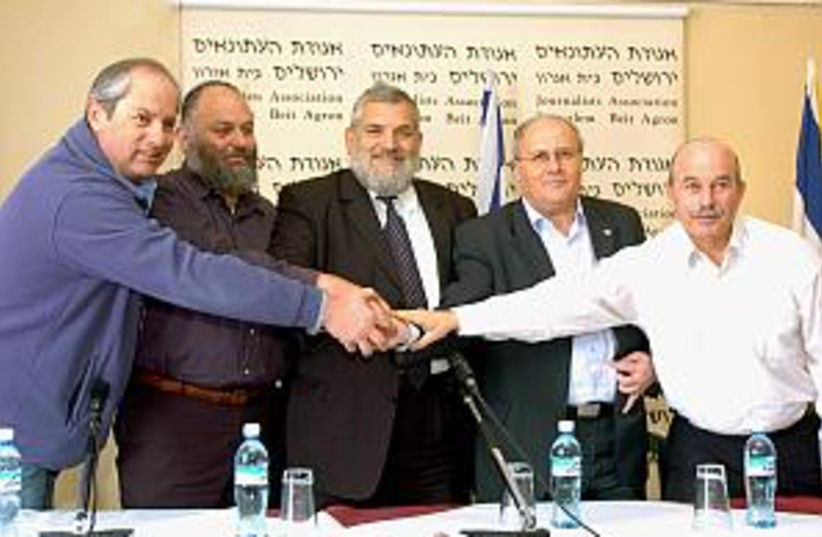 NRP, NU mks shake hands (photo credit: Ariel Jerozolimski)