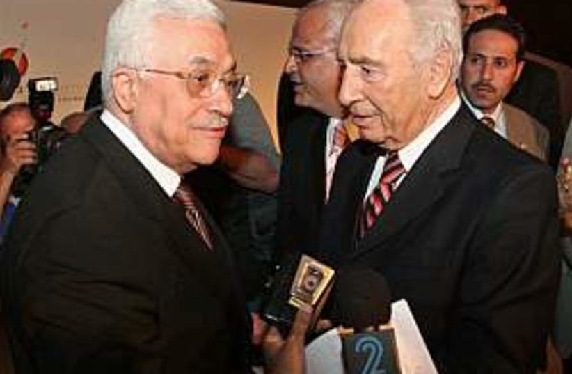peres with abbas in petr (photo credit: AP)