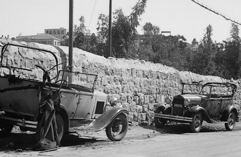 Two destroyed cars owned by Jews, 1936