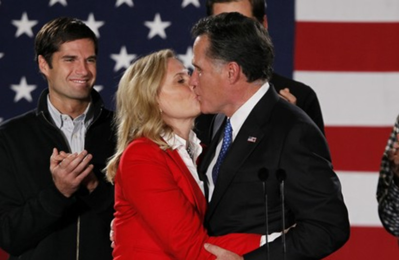 Mitt Romney kisses his wife Ann