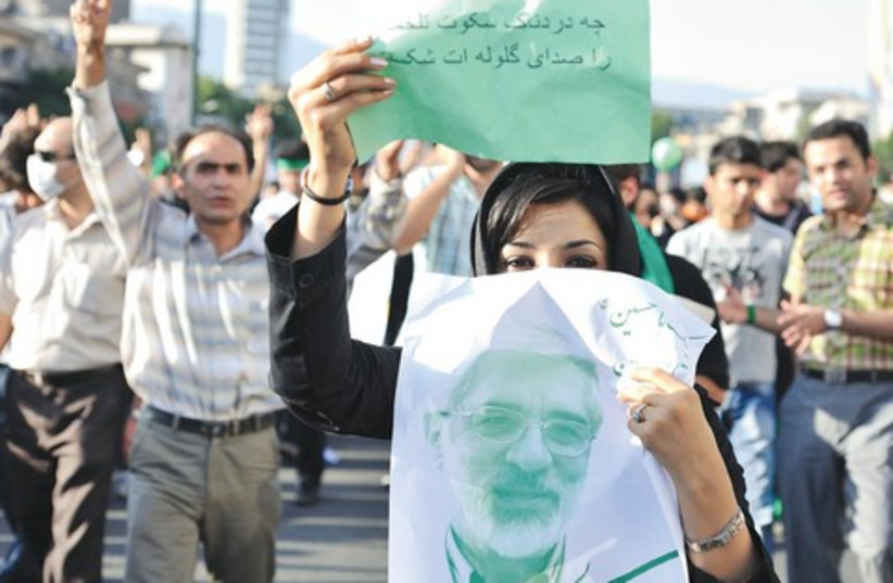 A woman protesting elections in Tehran
