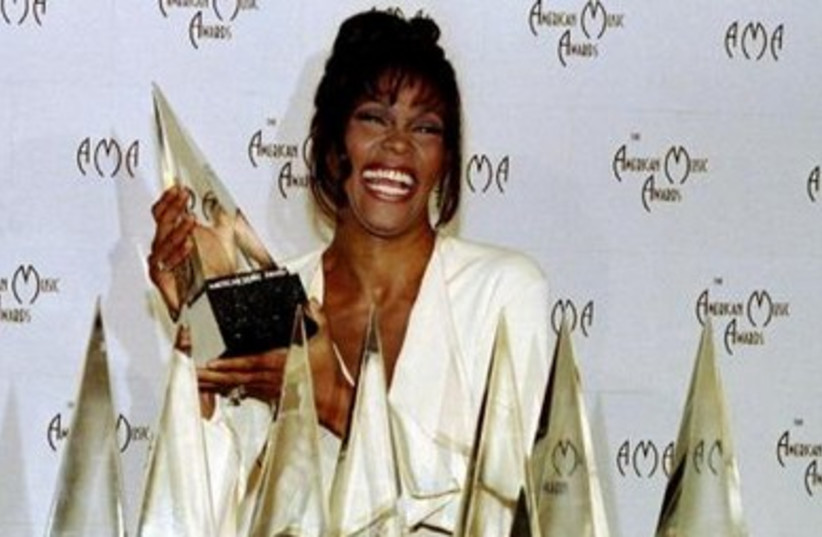 1994:Whitney with her 7 awards at 21st American Music Awards