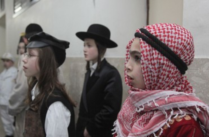 Constumed children celebrate Purim in Mea Shearim