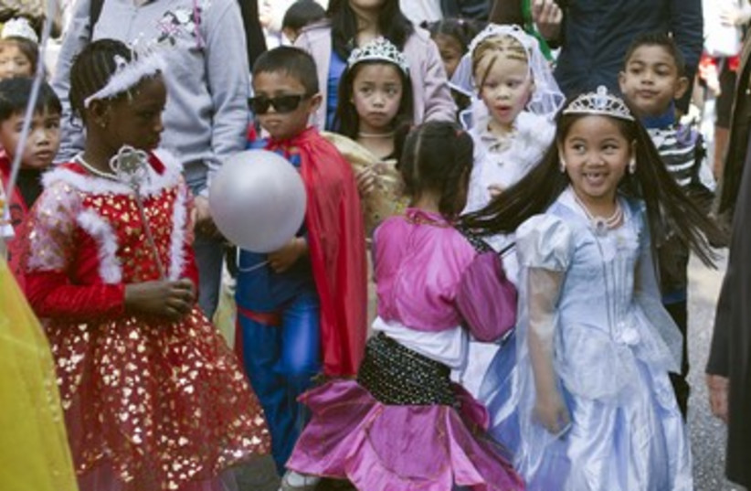 Schoolchildren in Tel Aviv wear costumes for Purim 