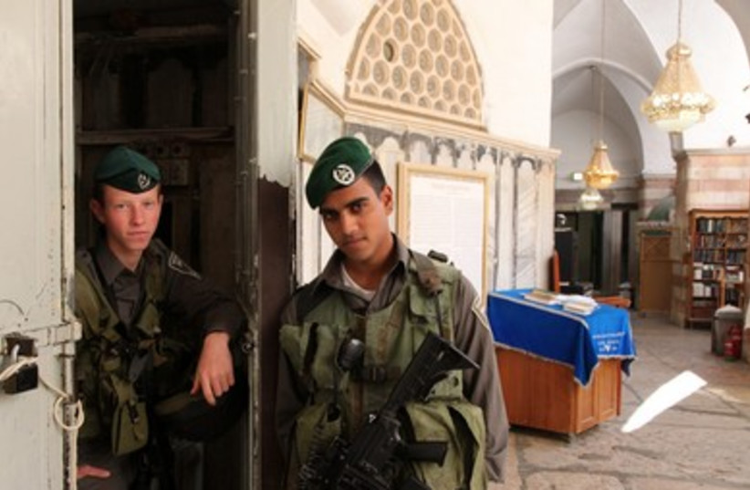 Soldiers standing guard at the Cave of the Patriarchs