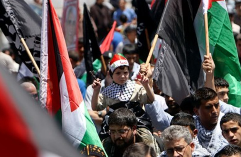 Palestinians take part in a rally marking Nakba in the West Bank
