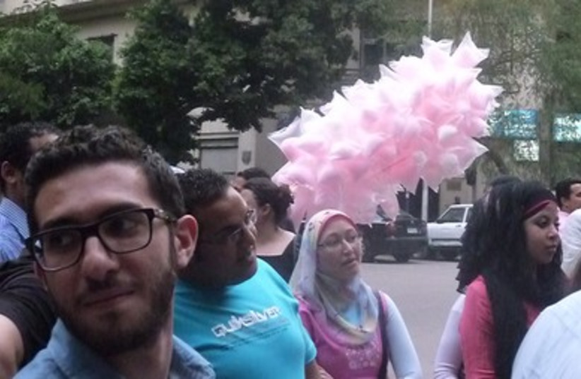 An Egyptian man sells cotton candy at the event