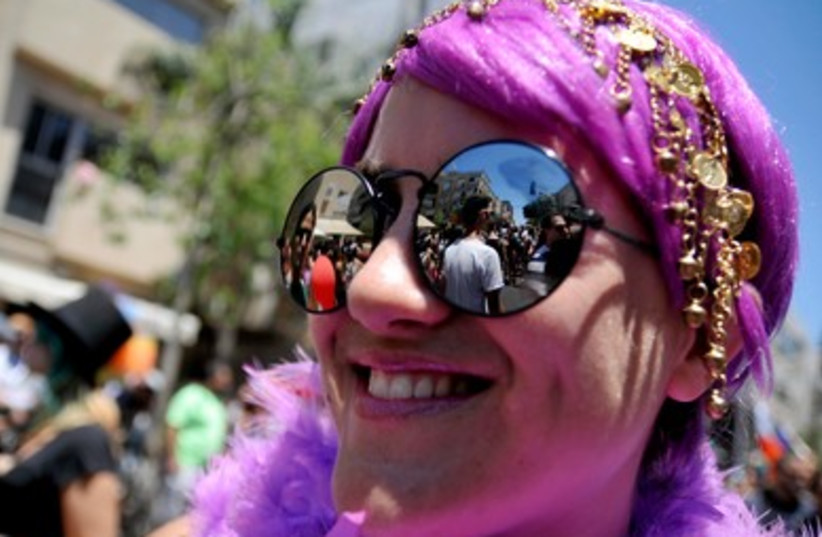 People dress in extravagant costumes in expression of pride