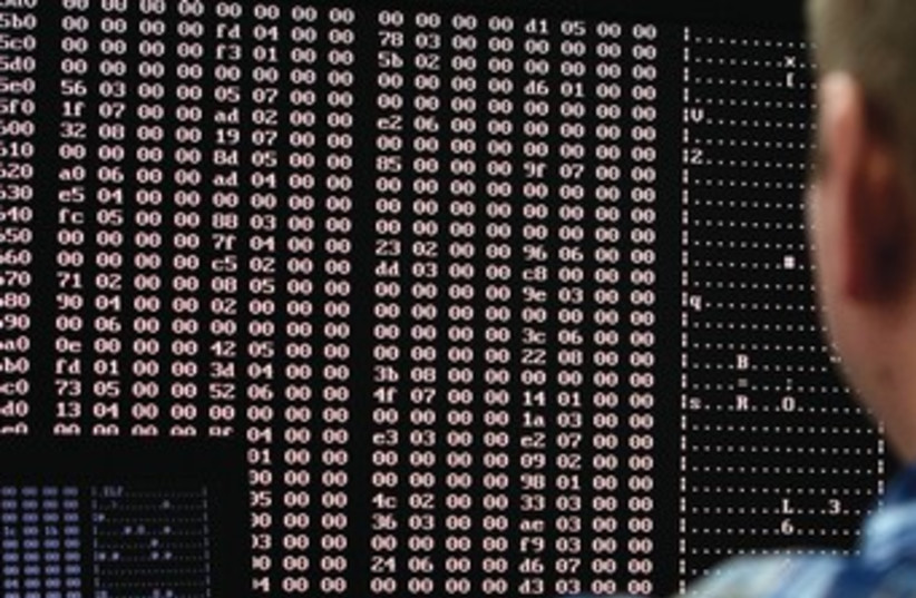 cyber hack virus hacking 370 (credit: Jim Urquhart/Reuters)