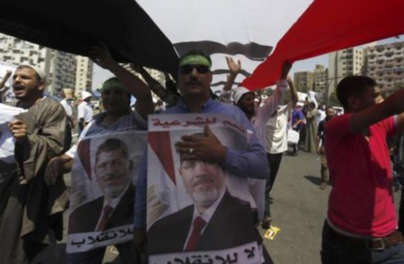 Pro-Morsi protesters march and yell in Cairo 390