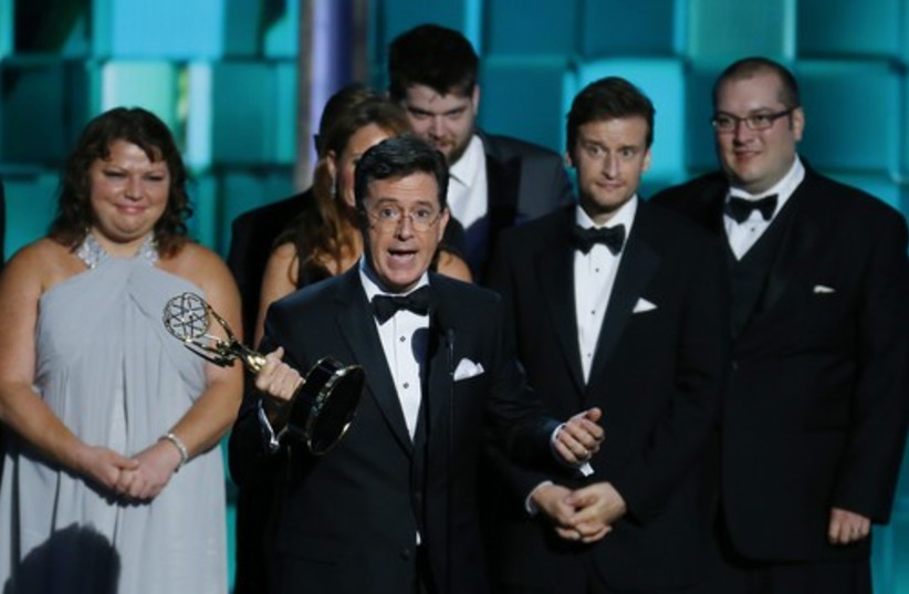 Stephen Colbert accepts the award for Outstanding Writing Fo