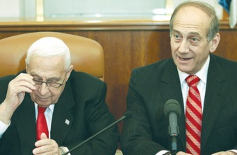 Sharon with finance minister Ehud Olmert on January 4, 2006, just hours before he suffered a stroke that sent him into a coma until his death.