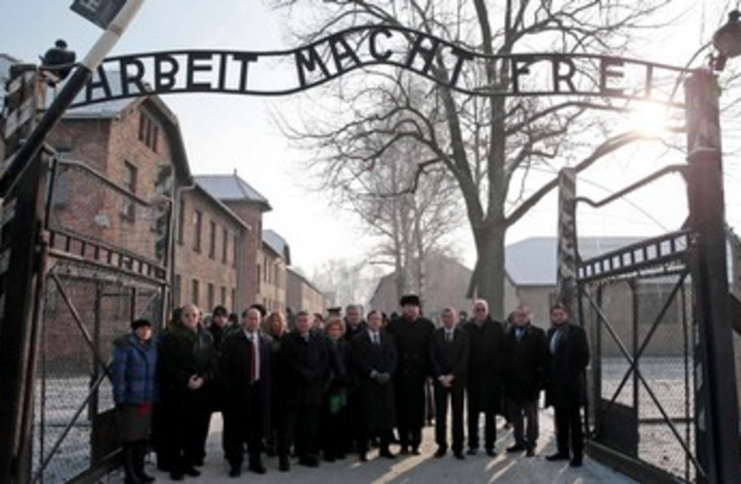 Members of the Knesset pose at the entrance of Auschwitz concentration camp