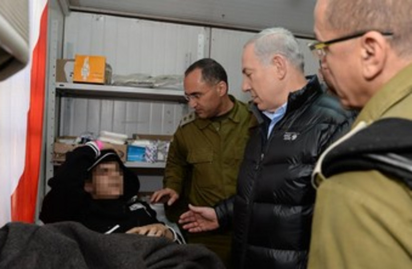 Netanyahu looks at Syrian patient IDF field hospital