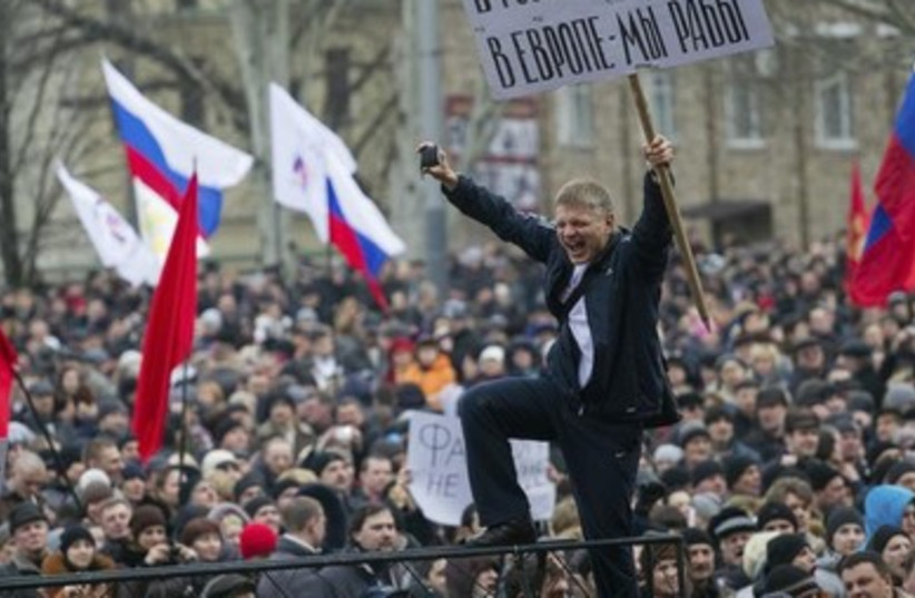 Pro-Russian protesters rally in central Donetsk.