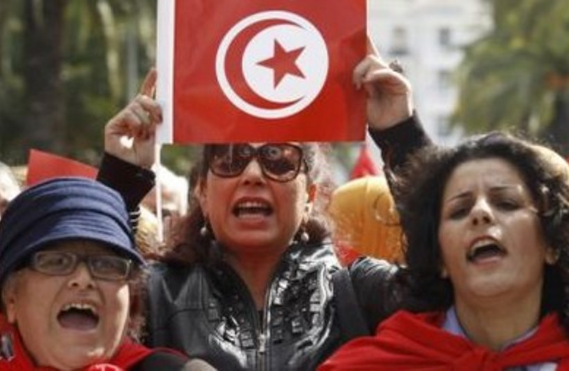 A Tunisian woman during a march to celebrate International Women's Day in Tunis March 8, 2014.