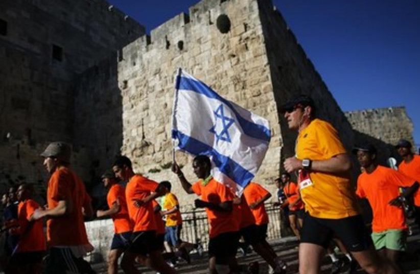 Athletes participate in the fourth international Jerusalem marathon March 21, 2014.