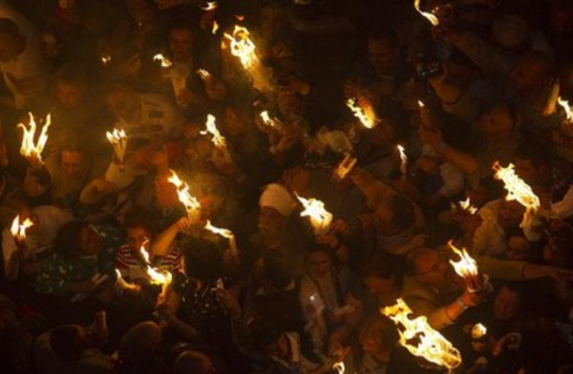 Worshippers take part in the Christian Orthodox Holy Fire ceremony at the Church of the Holy Sepulchre in Jerusalem.