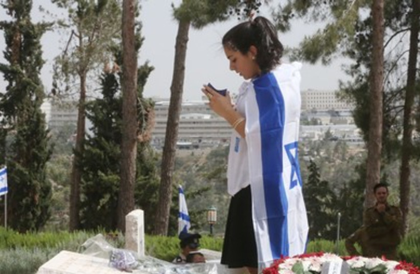 Israelis gather at the military cemetery on Mt. Herzl to pay respects to fallen loved ones.