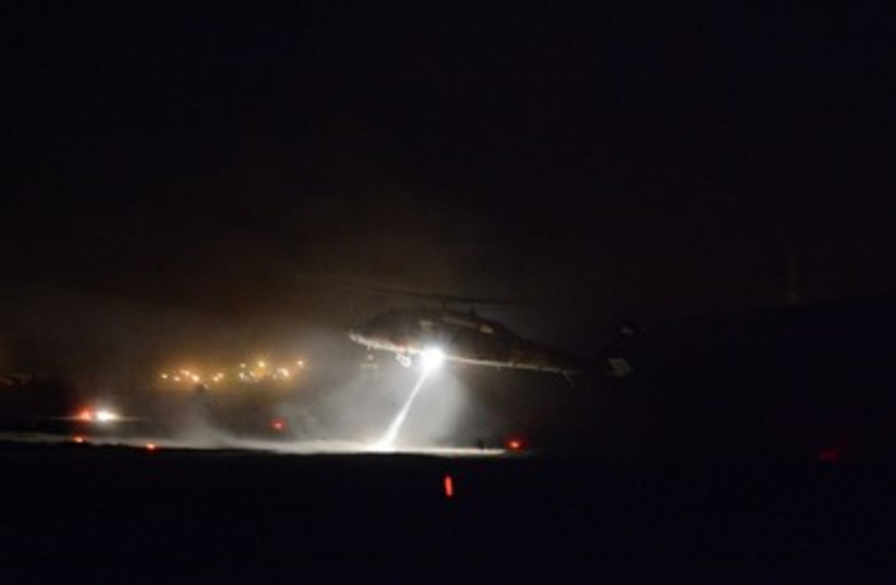 An IAF helicopter transports troops to the West Bank in search for the missing teens.