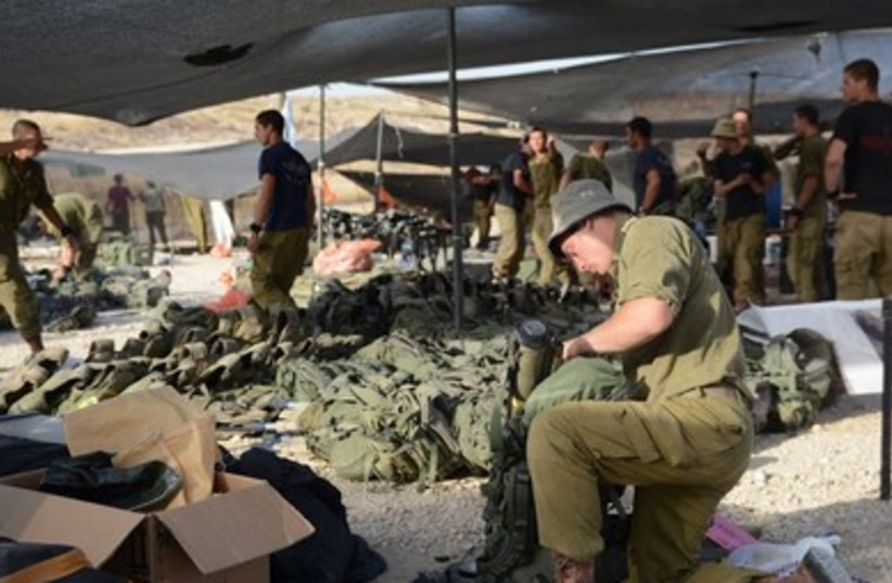 IDF soldiers from the Paratroopers Brigade prepare to embark on their mission in the West Bank.