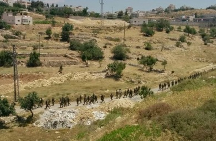 IDF soldiers from the Paratroopers Brigade search for the missing teens near Hebron.