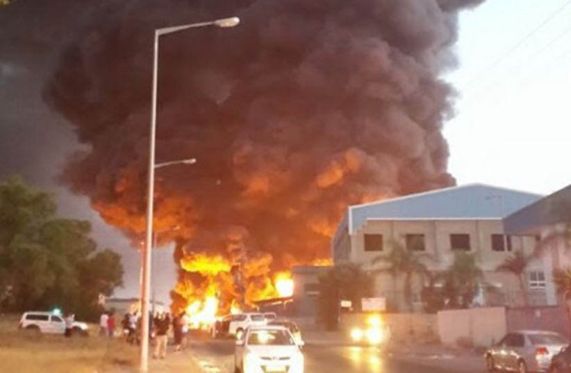 Sderot factory catches fire after begin hit by a rocket from Gaza.