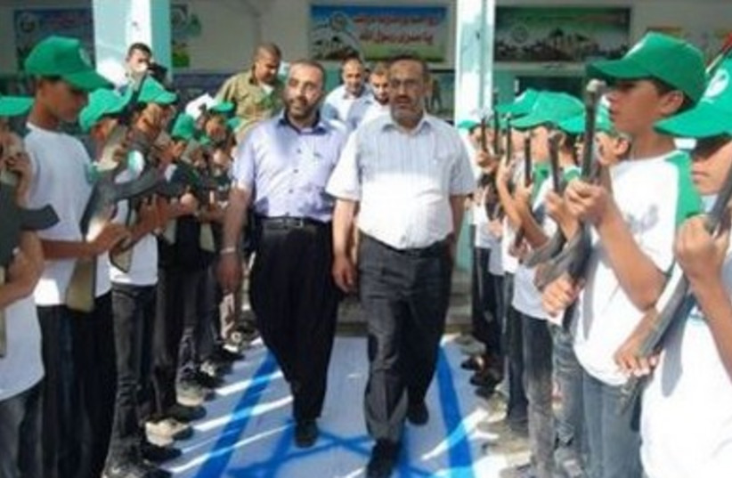Palestinian children attend a Hamas-run summer camp in Gaza.
