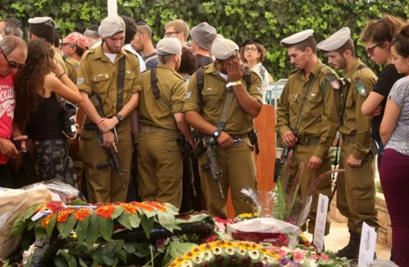 Mourners attend the funeral of St.-Sgt. Amit Yaori in Jerusalem.