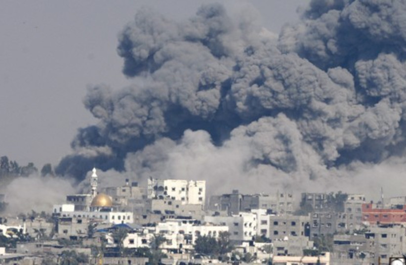 Smoke rises following what witnesses said were Israeli air strikes in the east of Gaza City