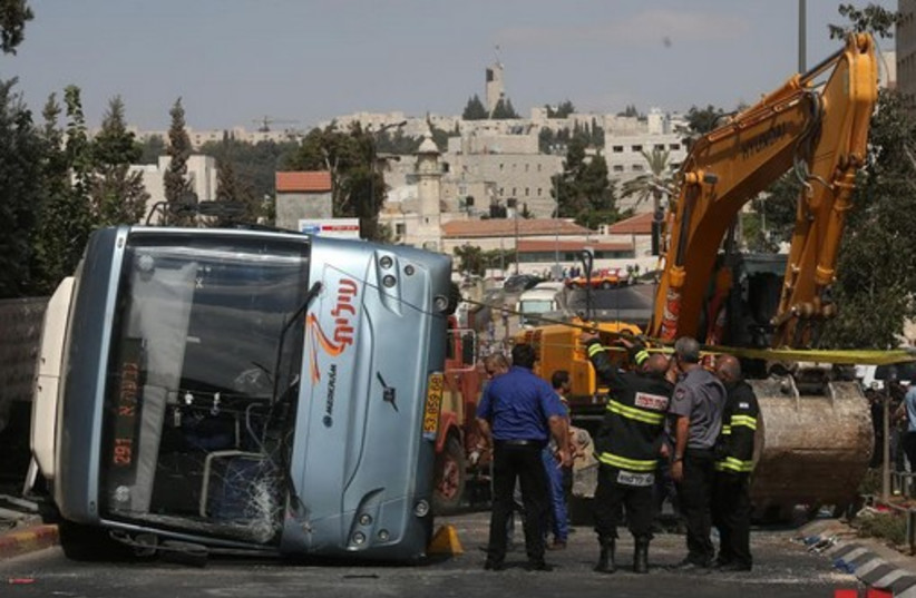 Bus flipped by tractor in Jerusalem terror attack