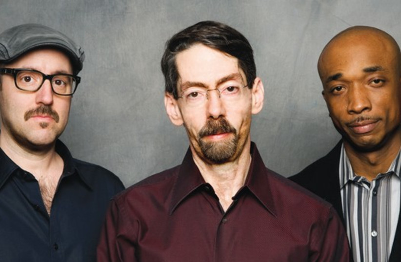 Jazz pianist Fred Hersch (middle) seen here with trio members John Hébert (left) and Eric McPherson. (credit: MATTHEW RODGERS)