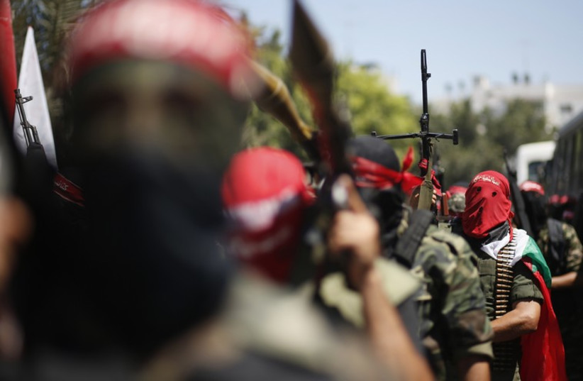 Palestinian militants from the Popular Front for the Liberation of Palestinian (PFLP) take part in a military show in Gaza City September 2