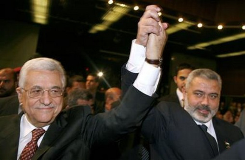 Hamas deputy political bureau chief Ismail Haniyeh (R) and Palestinian Authority President Mahmoud Abbas. (credit: REUTERS)