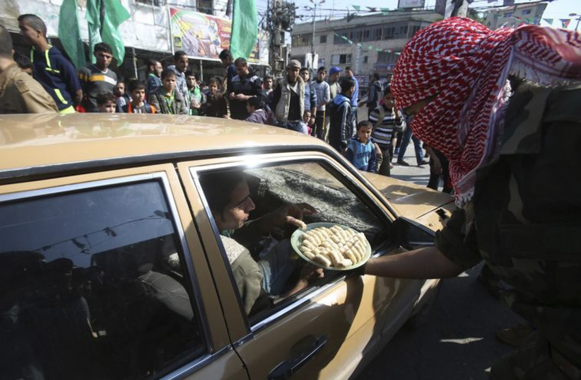 Gazans in Rafah celebrate the attack on a Jerusalem synagogue, November 18, 2014.‏