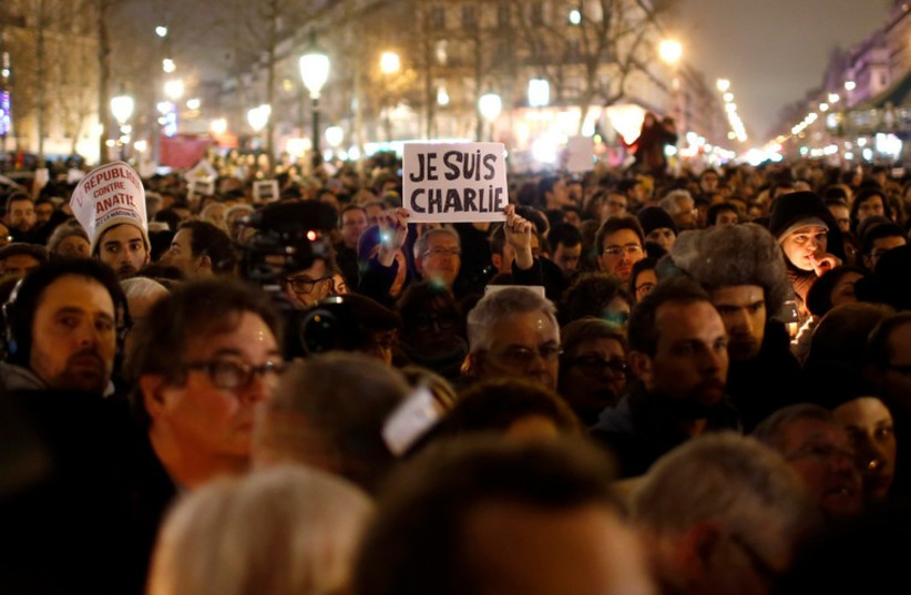 Paris vigil for victims of the shooting that left 12 dead at office of a satirical magazine