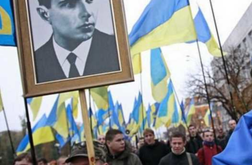 Portrait of UPA leader Stepan Bandera (left) at a rally marking the anniversary of the Ukrainian Insurgent Army (UPA), which fought both Nazi and Soviet forces in World War II [File] (credit: REUTERS)