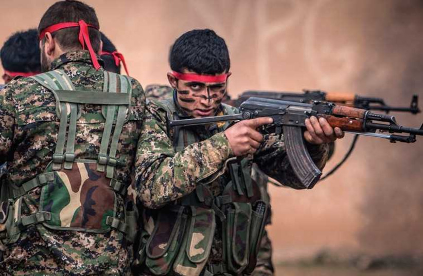 Fighters of the Kurdish People’s Protection Units (YPG) in training at a military camp in Ras al-Ain, February 13 (credit: REUTERS)
