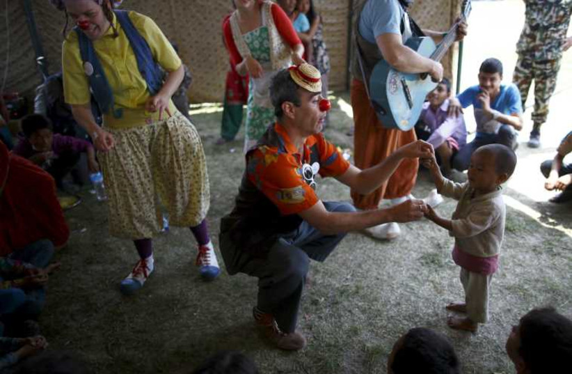 Medical clowns perform in front of children affected by earthquake in Kathmandu.
