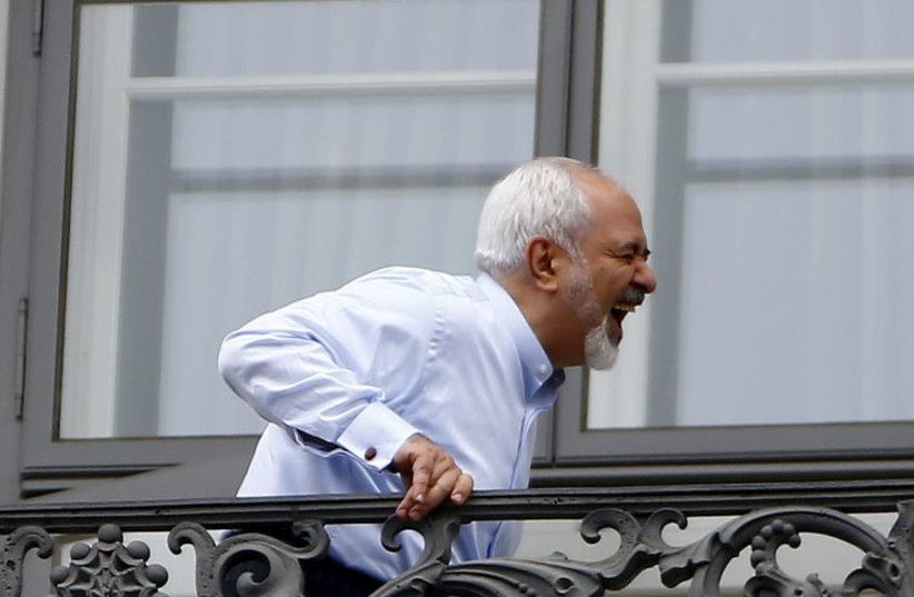 Iranian Foreign Minister Javad Zarif stands on the balcony of Palais Coburg, the venue for nuclear talks, Austria, July 13, 2015. 
