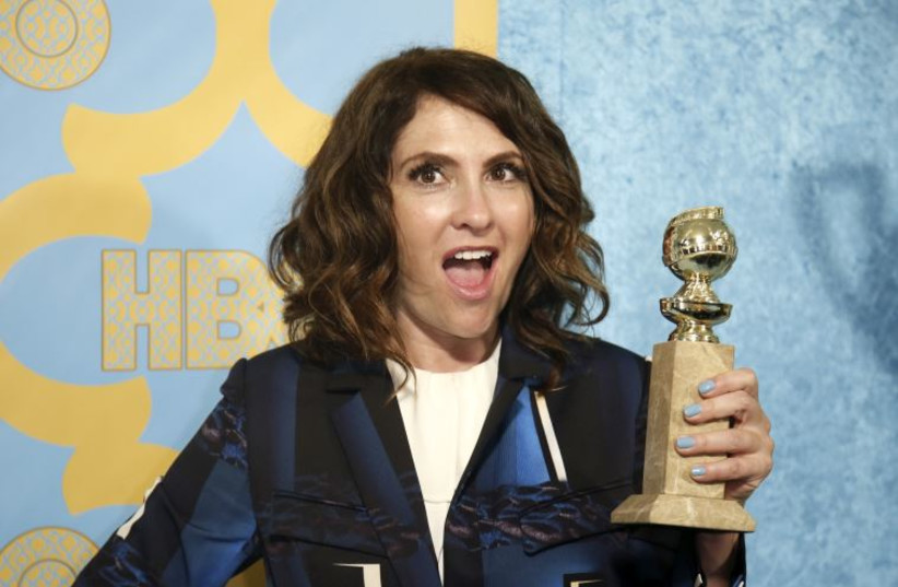 Program creator Jill Soloway poses with the award for Best Television Series - Comedy or Musical for 'Transparent' at the HBO after party after the 72nd annual Golden Globe Awards in Beverly Hills, California