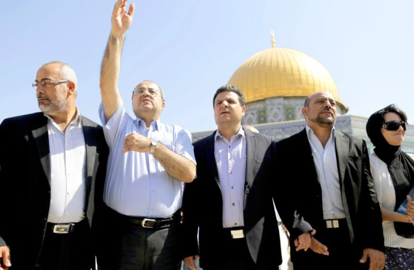 Lawmakers from the Joint Arab List stand in front of the Dome of the Rock during a visit to the compound in Jerusalem's Old City, July 28
