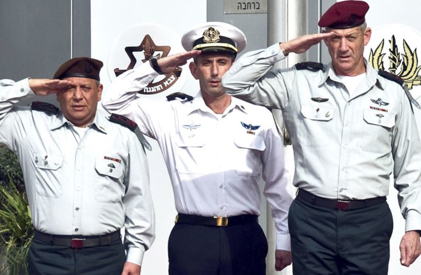 Incoming Chief of Staff Lt.-Gen. Gadi Eizenkot (left) and outgoing Chief of Staff Lt.-Gen. Benny Gantz salute during a handover ceremony at the Kirya base in Tel Aviv, February 16