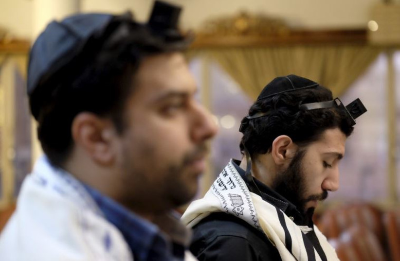 Iranian Jews pray at the Abrishami synagogue on Palestine Street in Tehran