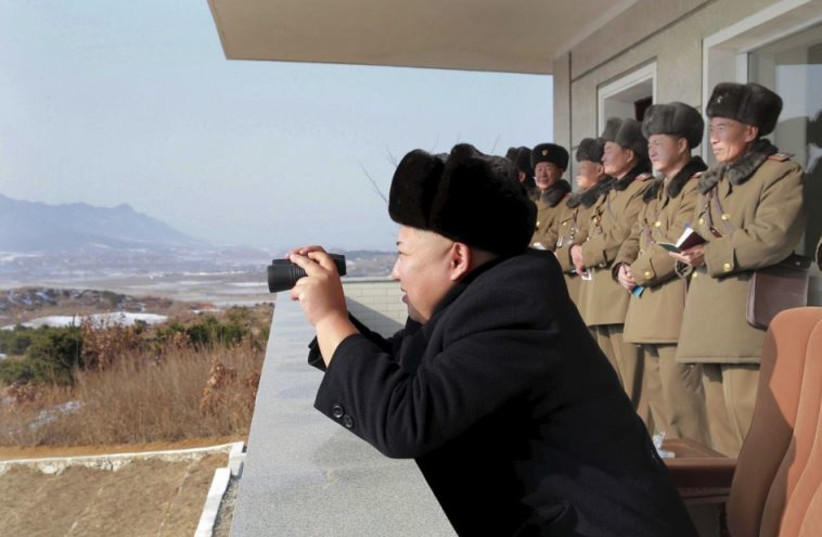 North Korean leader Kim Jong Un watches maneuvers between KPA large combined units 526 and 671 at undisclosed location in   this undated photo released by North Korea's Korean Central News Agency
